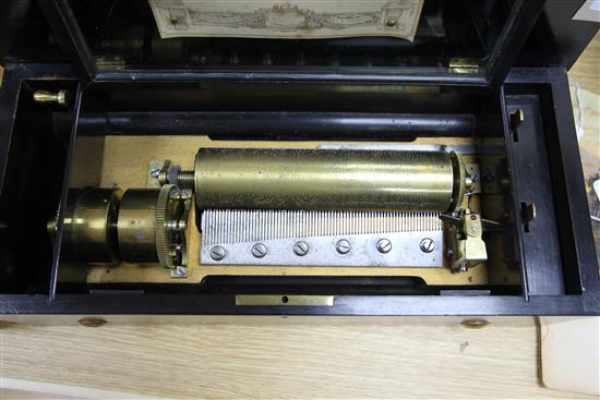 A Swiss six air Etouffoirs en Acier cylinder music box, no. H8020, with part hand-written label, in inlaid rosewood and ebonised case